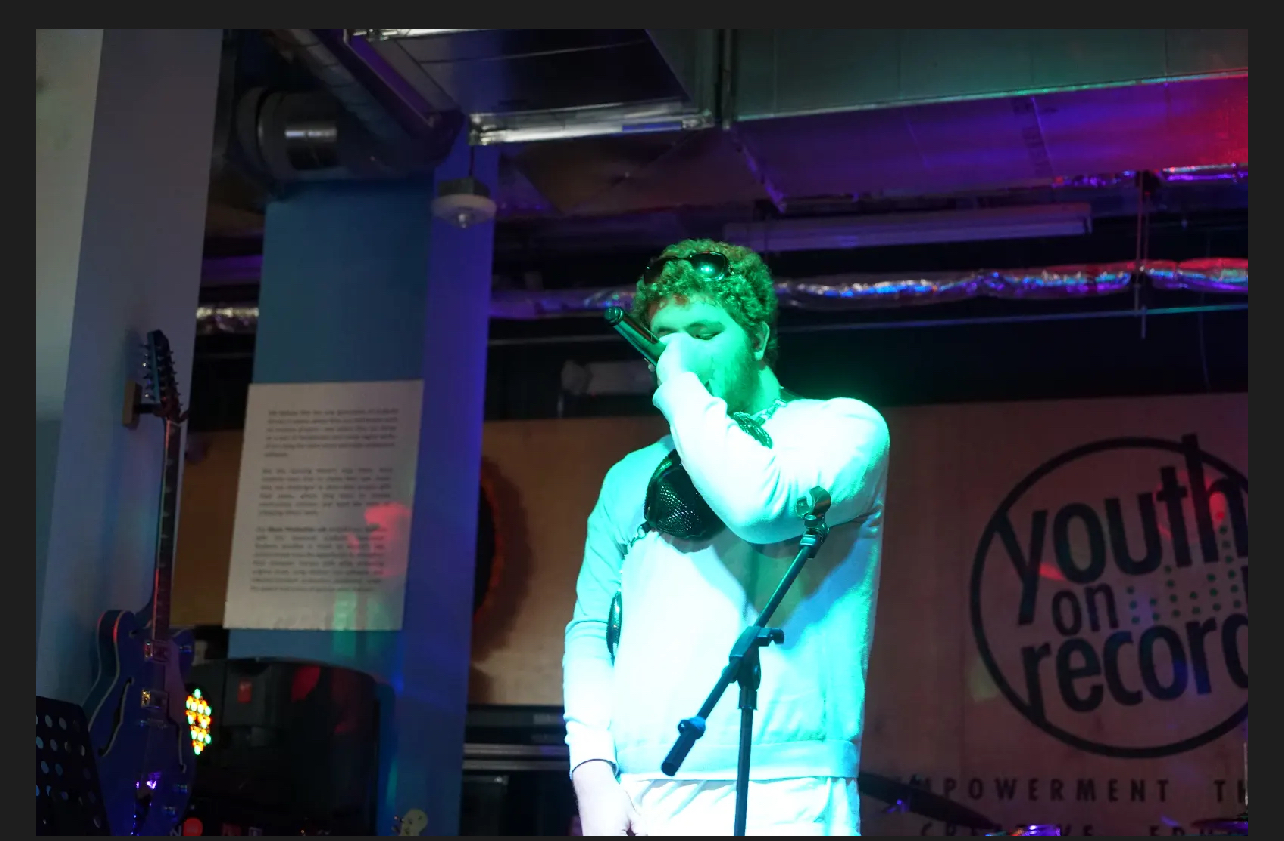 August Flowers performs at Open Mic