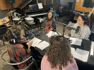 Podcast interns record a roundtable discussion