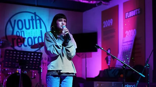 Clara performs at open mic