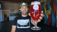Jason zumBrunnen from Ratio Beerworks, holding a glass of beer