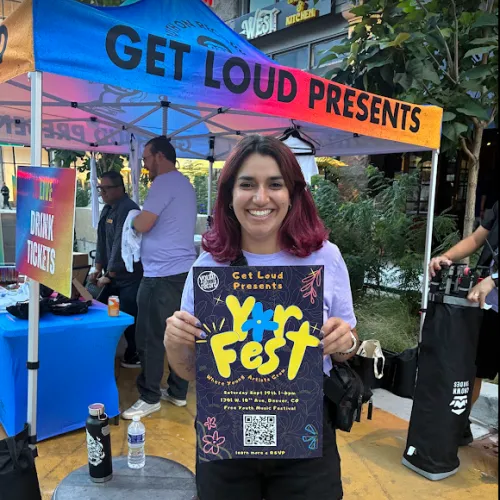 Sydney working at 16 LIVE and holding a YOR Fest poster