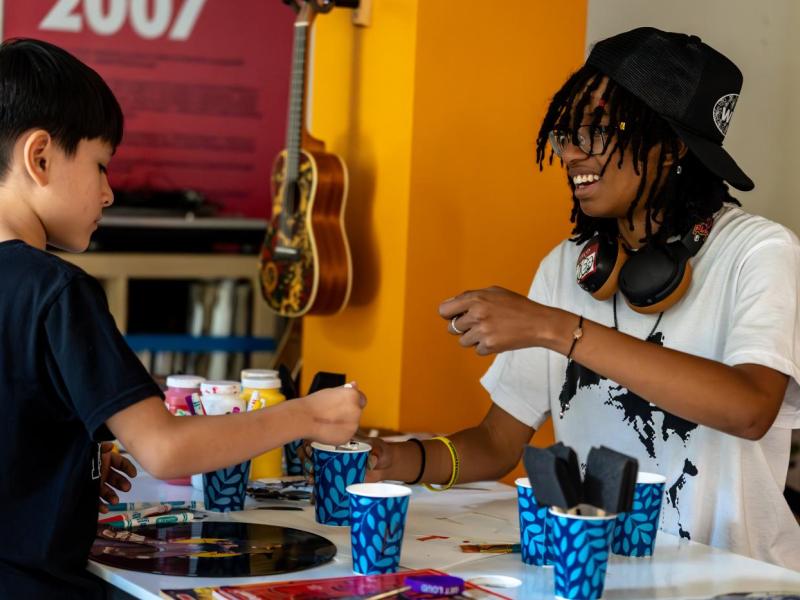 Kimora runs the collage art station