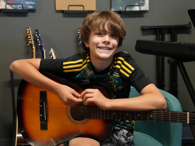 camper with guitar