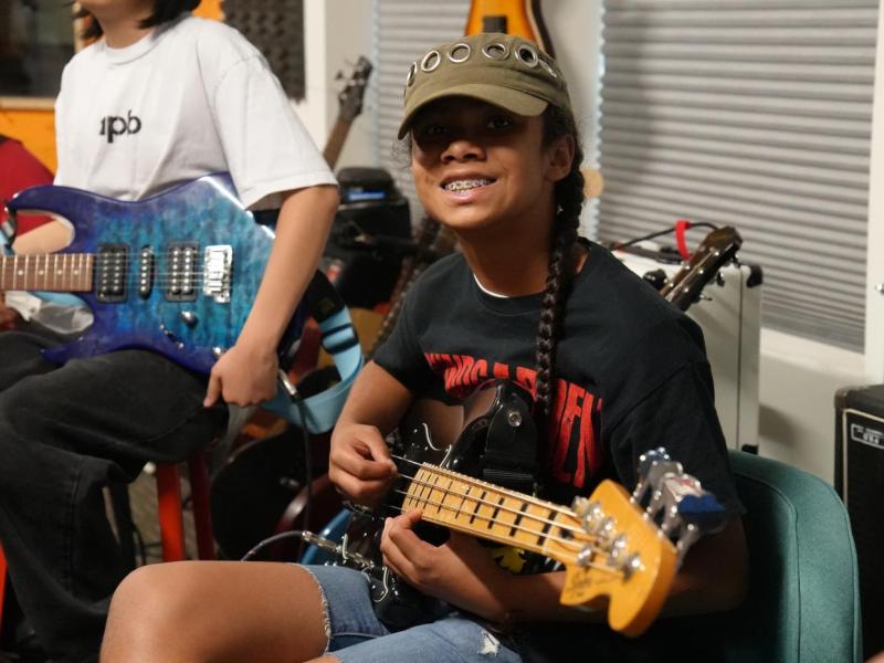camper plays guitar